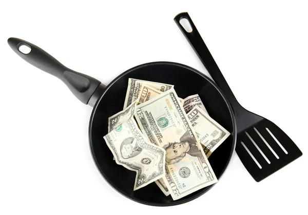 Banknotes in a frying pan with cooking spatula isolated on white — Stock Photo, Image
