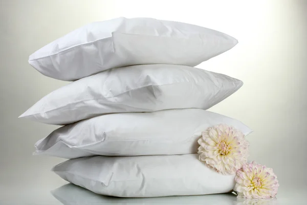 Pillows and flowers, on grey background — Stock Photo, Image
