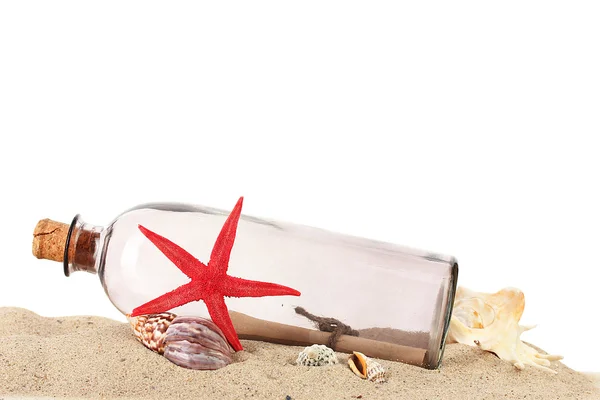 Glass bottle with note inside on sand isolated on white — Stockfoto