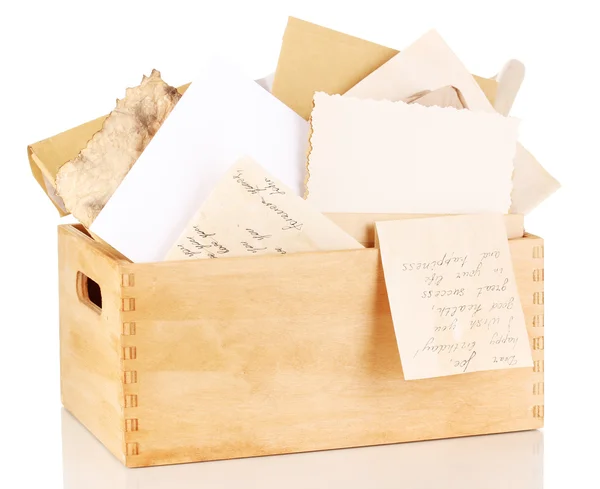 Wooden crate with papers and letters isolated on white — Stock Photo, Image