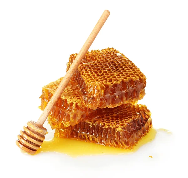 Söt honeycomb och trä drizzler, isolerade på vit — Stockfoto