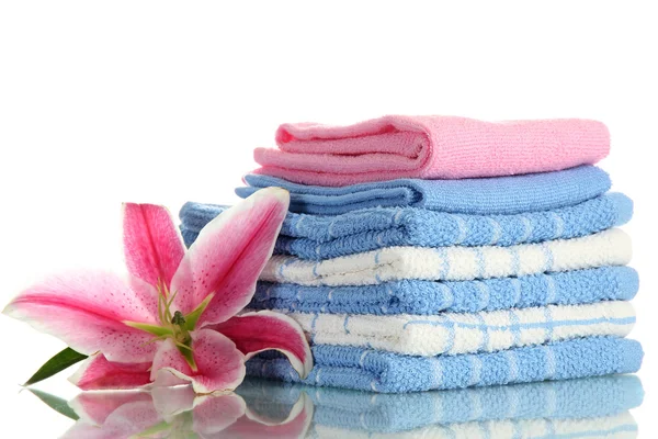 Towels with beautiful pink lily, isolated on white — Stock Photo, Image