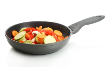 Frying pan with vegetables on white clipart
