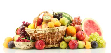 Assortment of exotic fruits and berries in baskets isolated on white clipart