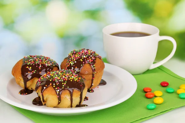 stock image Appetizing cupcakes with chocolate on nature background