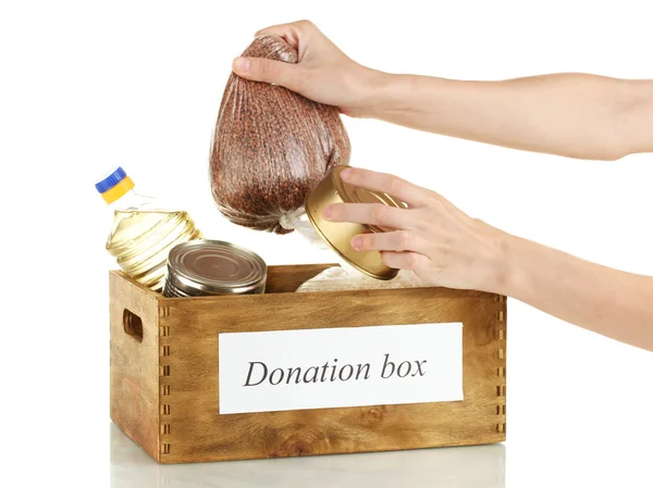 Caixa de doação com alimentos em fundo branco close-up — Fotografia de Stock