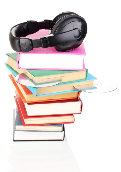 Headphones on books isolated on white — Stock Photo, Image