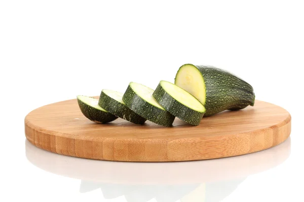 Sliced zucchini on chopping board isolated on white — Stock Photo, Image