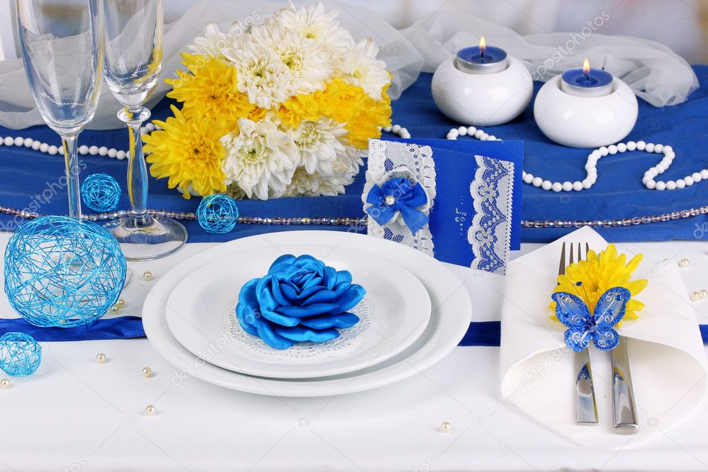 Serving fabulous wedding table in purple and blue color close-up