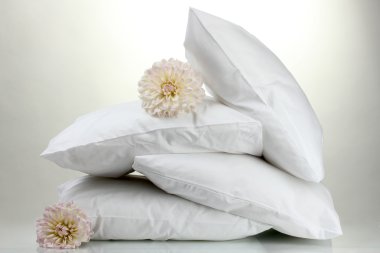 Pillows and flowers, on grey background