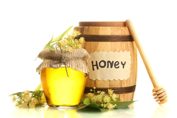 Jarra e barril com mel de tília e flores isoladas em branco — Fotografia de Stock
