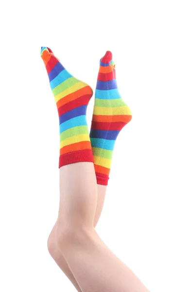 Female legs in colorful striped socks isolated on white — Stock Photo, Image