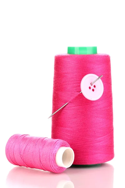 กระสวยสีชมพูที่มีเข็มและปุ่มแยกกันบนสีขาว — ภาพถ่ายสต็อก