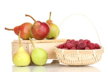 Ripe raspberries in basket and pears on crate isolated on white clipart