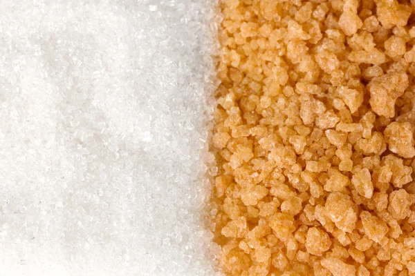 Witte suiker en bruine suiker achtergrond close-up — Stockfoto