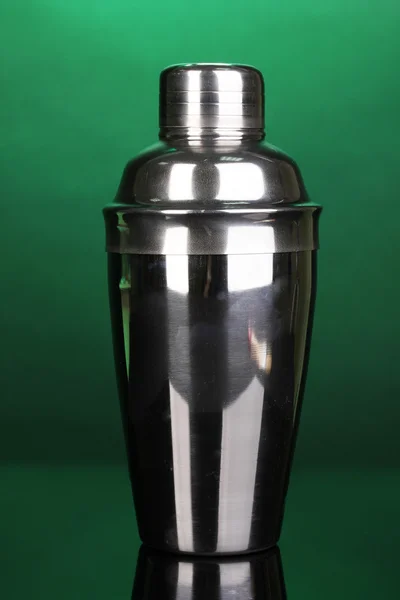 Cocktail shaker on green background — Stock Photo, Image