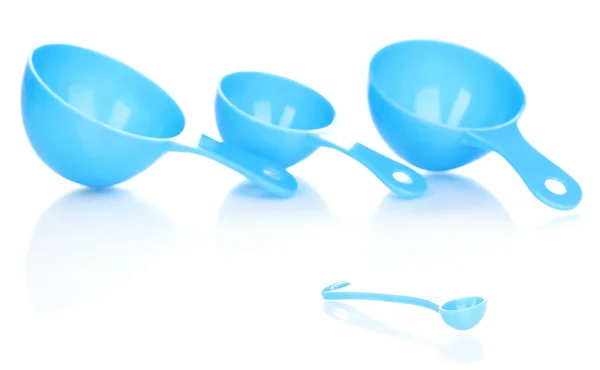 Blue measuring spoons isolated on white — Stock Photo, Image