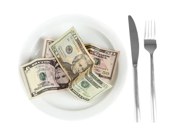 Деньги на тарелке выделены на белом фоне крупным планом — стоковое фото