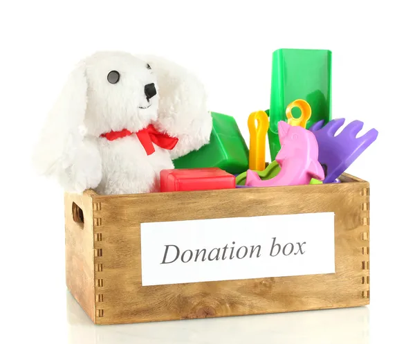 Bağış kutusu çocuk oyuncakları ile üzerine beyaz izole — Stok fotoğraf