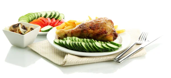Roast chicken with french fries and sliced vegetables on plates, isolated on white — Stock Photo, Image