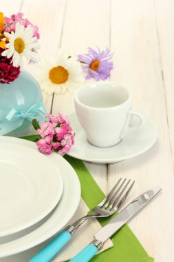 Beautiful holiday table setting with flowers clipart