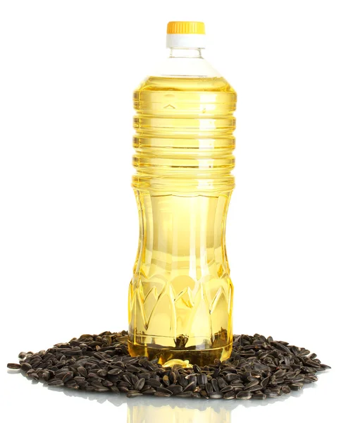 Подсолнечное масло с семенами подсолнечника на белом фоне — стоковое фото