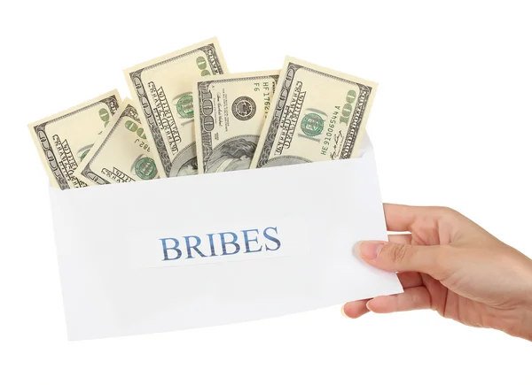 stock image Woman's hand holding an envelope with money on white background