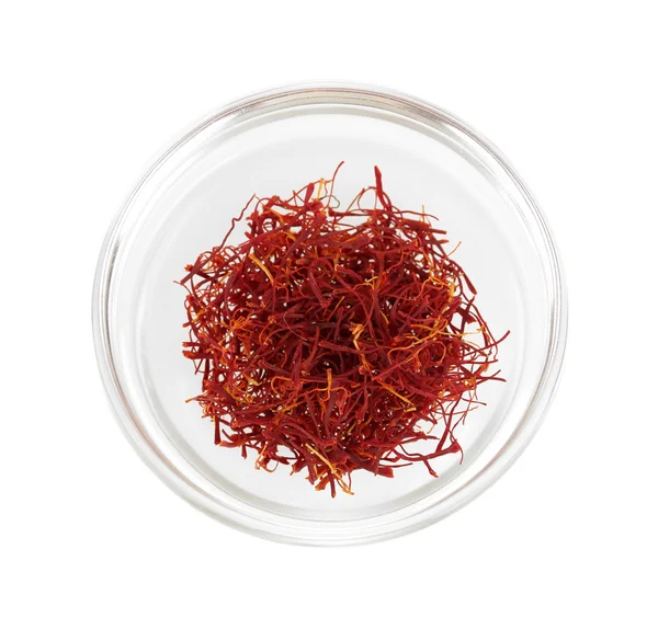 Stigmas of saffron in transparent bowl isolated on white background close-up — Stock Photo, Image