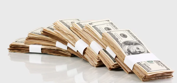 Many one hundred dollars banknotes close-up isolated on white — Stock Photo, Image