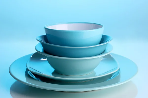 Blue tableware on blue background — Stock Photo, Image