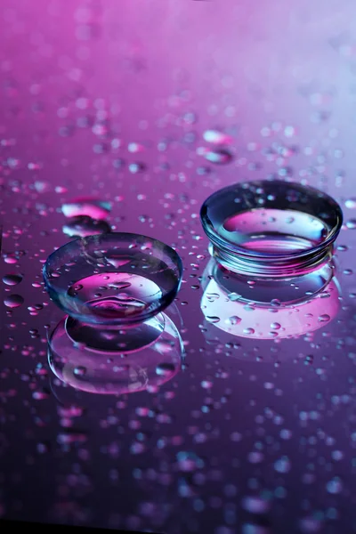 Contact lenses, on pink-blue background — Stock Photo, Image