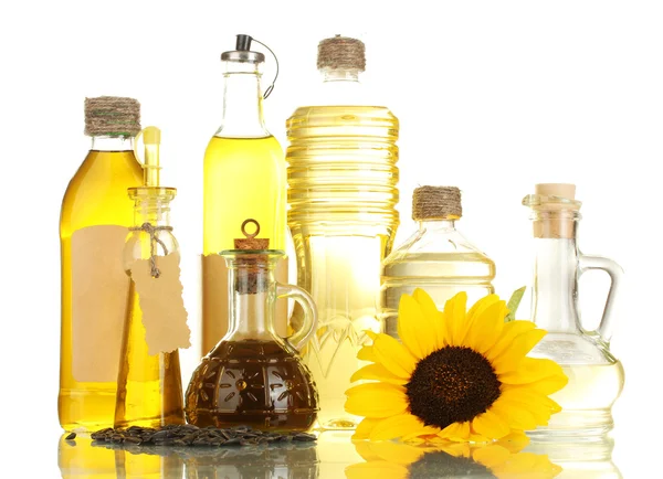 Olja i flaskor, solros och frön, isolerad på vit — Stockfoto