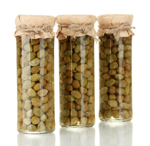 Glass jar with tinned capers isolated on white Stock Photo