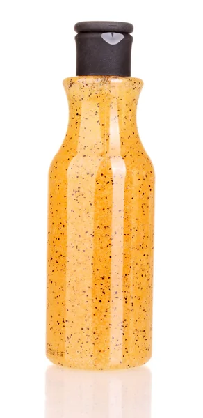 Bottle with scrub isolated on white — Stock Photo, Image