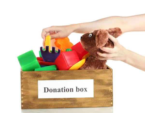 Caixa de doação com crianças brinquedos no fundo branco close-up — Fotografia de Stock
