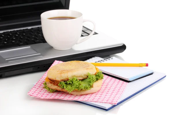 Eating at work place near laptop — Stock Photo, Image