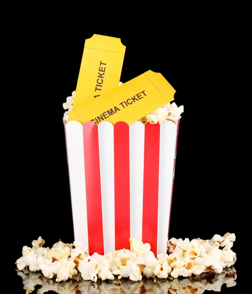Popcorn with cinema tickets isolated on black — Stock Photo, Image