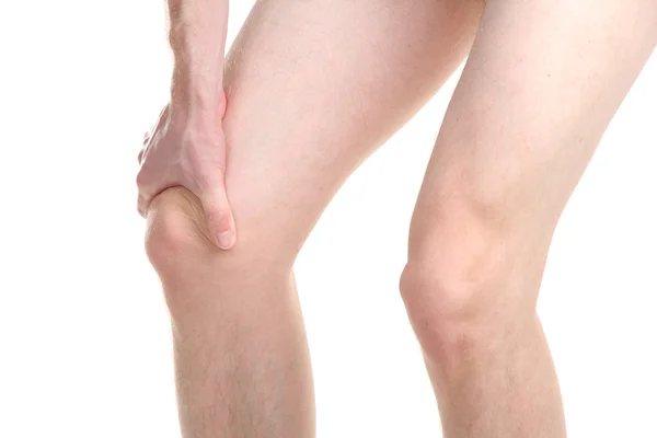 Hombre sosteniendo dolor de rodilla, aislado en blanco — Foto de Stock