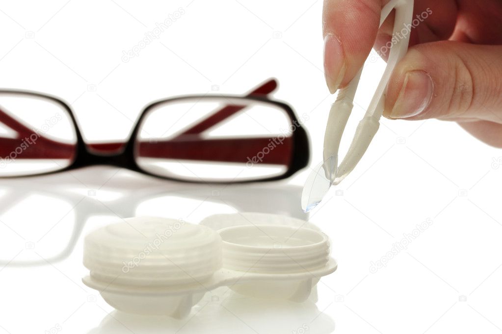 Glasses, contact lenses in containers and tweezers, isolated on white