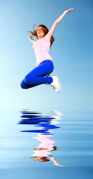 Attractive girl Young woman jumping sky — Stock Photo, Image