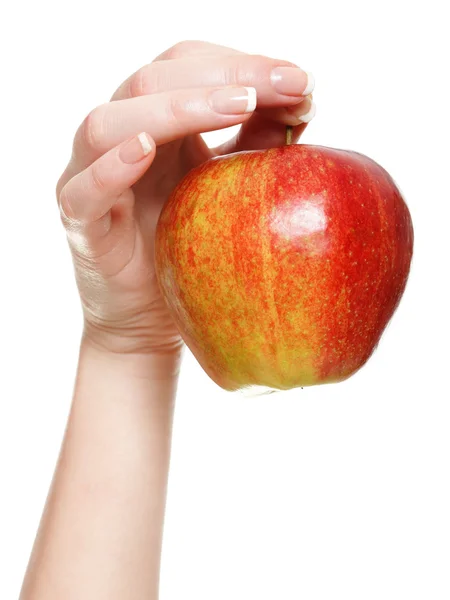 Frauenhand mit rotem Apfel isoliert — Stockfoto