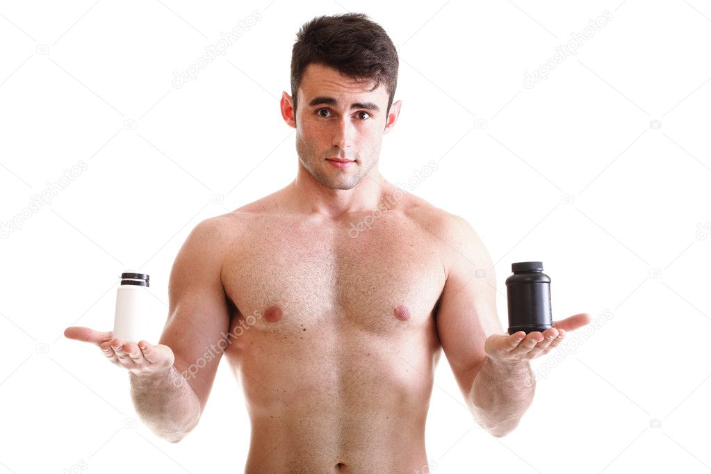 Sexy male body builder holding a boxes with supplements on his b
