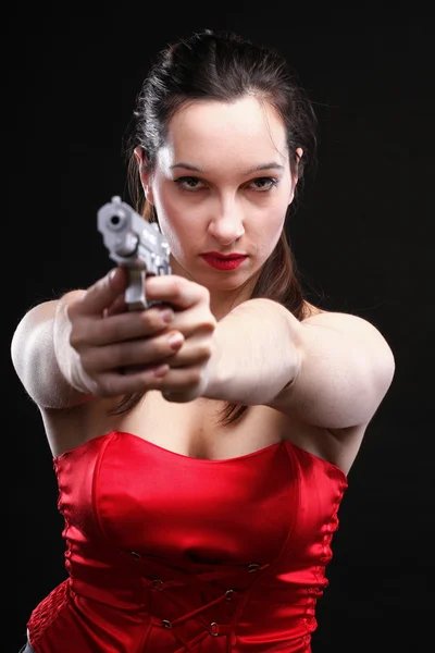 Sexy young woman - gun on black background — Stock Photo, Image