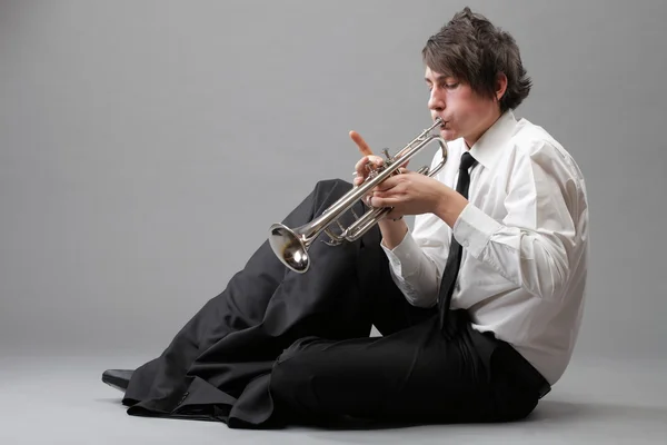 Portrait of a young man playing his Trumpet — Stock Photo, Image