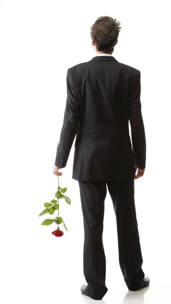 Junger Mann, Blume, rote Rose isoliert — Stockfoto
