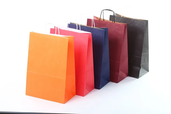 Zakupy prezent brązowe torby tło — Zdjęcie stockowe
