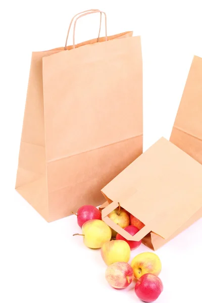 Shopping borse regalo marrone e mela isolato — Foto Stock