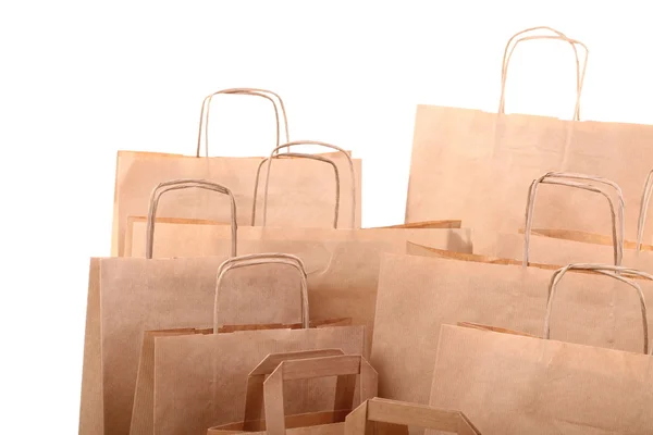 Compras bolsas de regalo marrón aislado — Foto de Stock