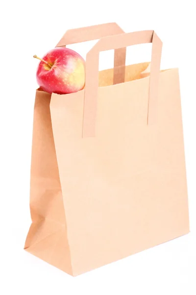 Shopping brun presentpåsar och apple isolerade — Stockfoto