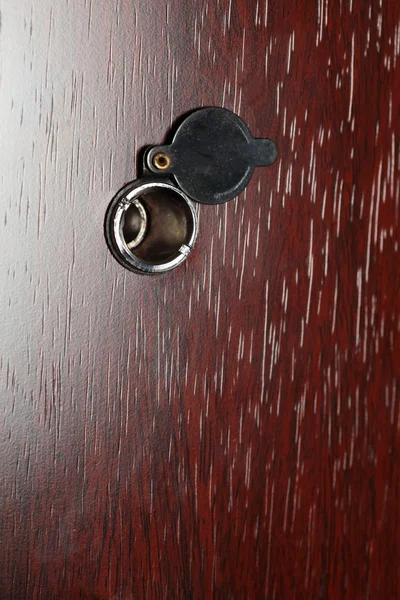 Peephole on wooden door — Stock Photo, Image